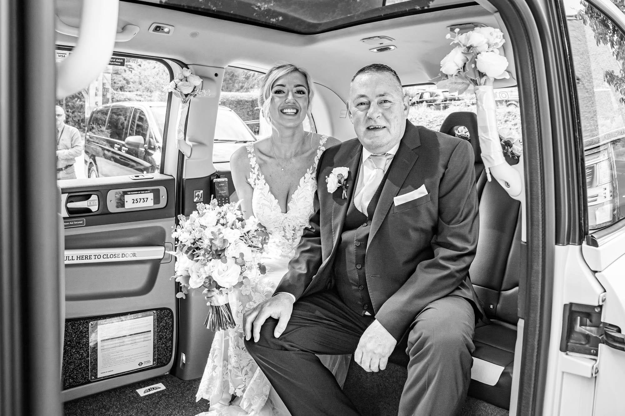Bride and her father arriving in taxi to church.