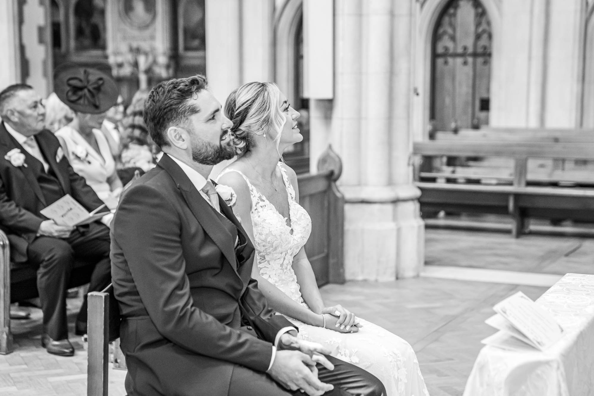 Bride and groom listening to the readings.