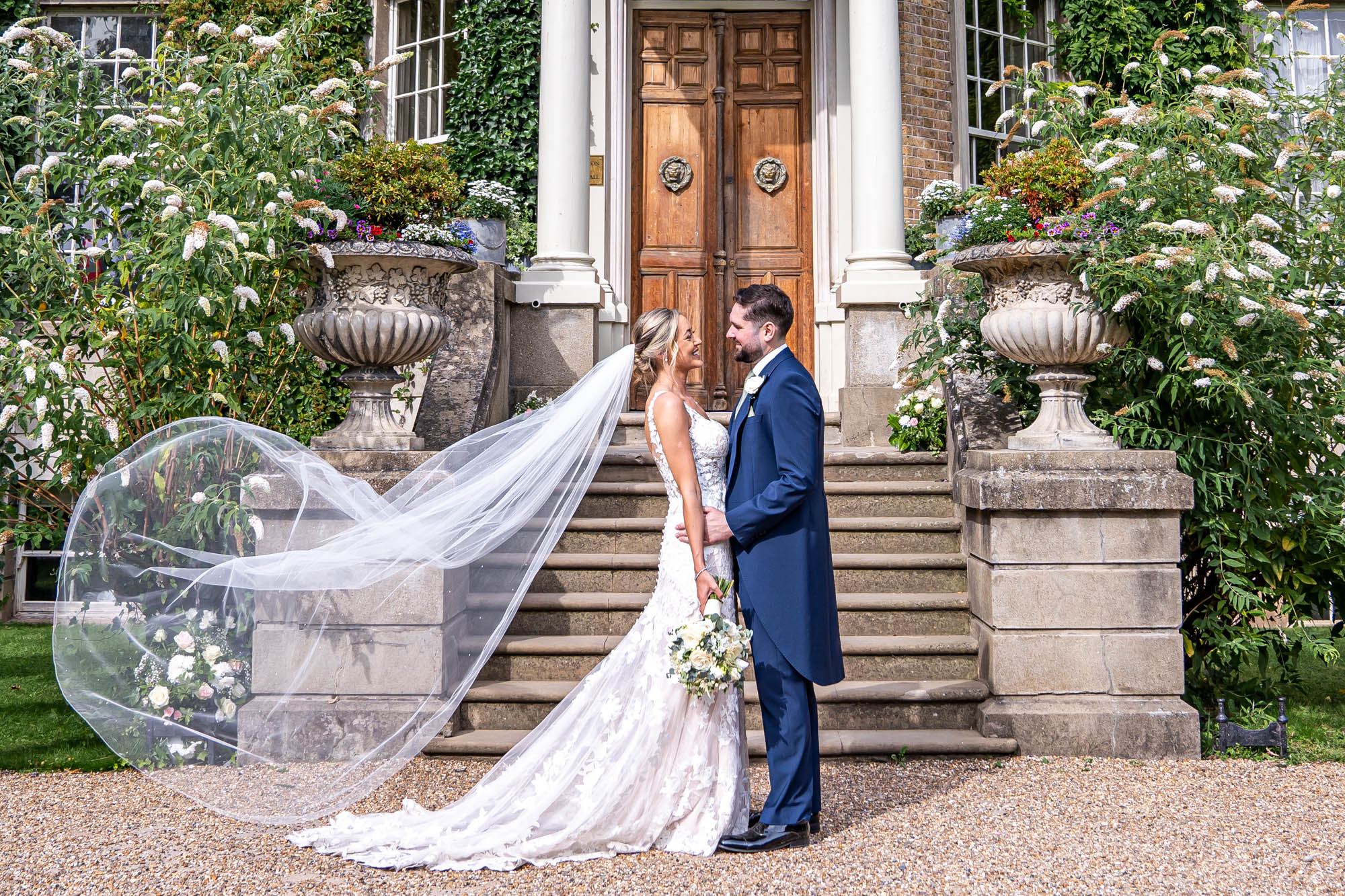 Newlyweds hug at wedding reception.