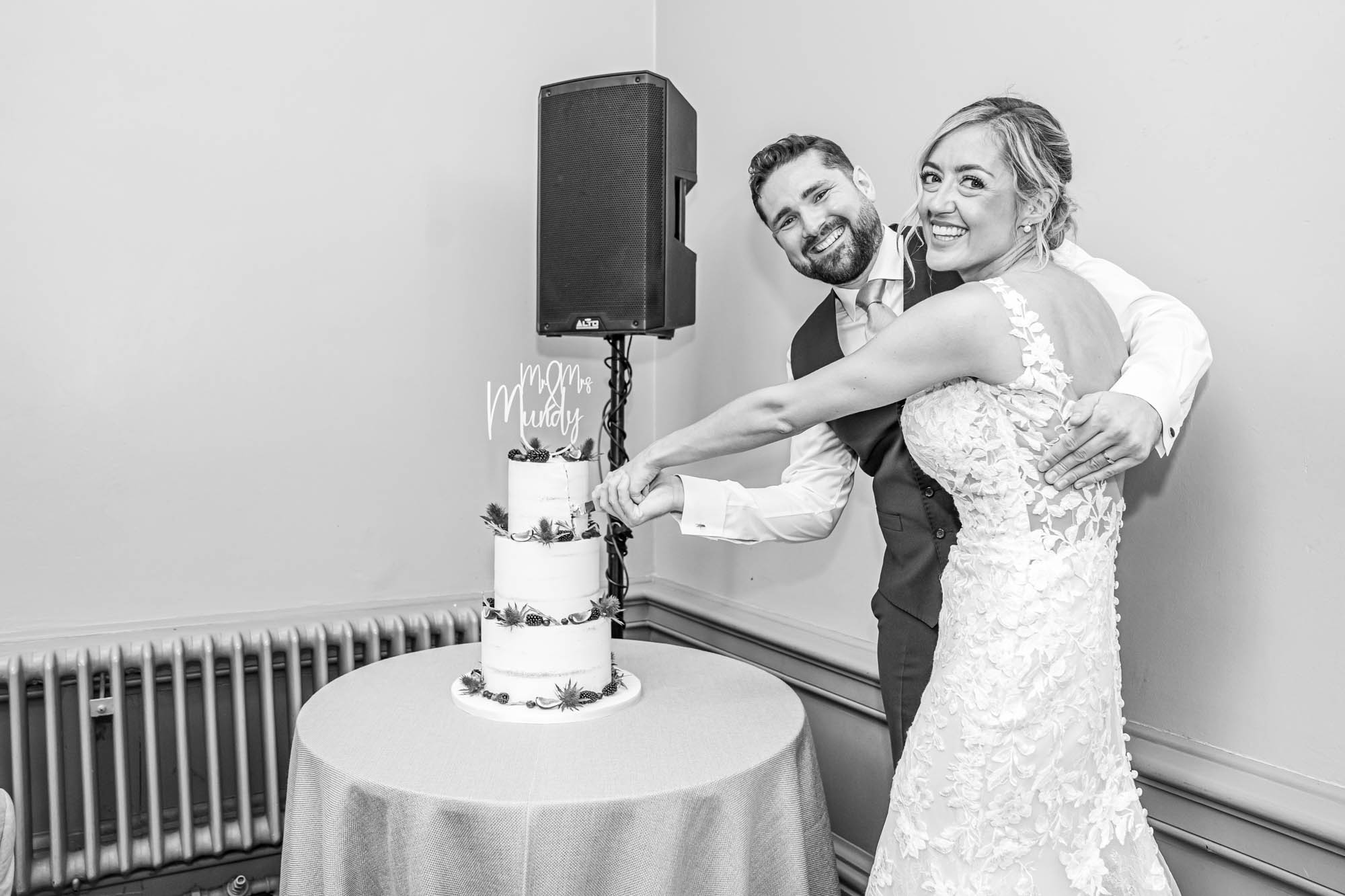 Bride and groom cutting their wedding cake.