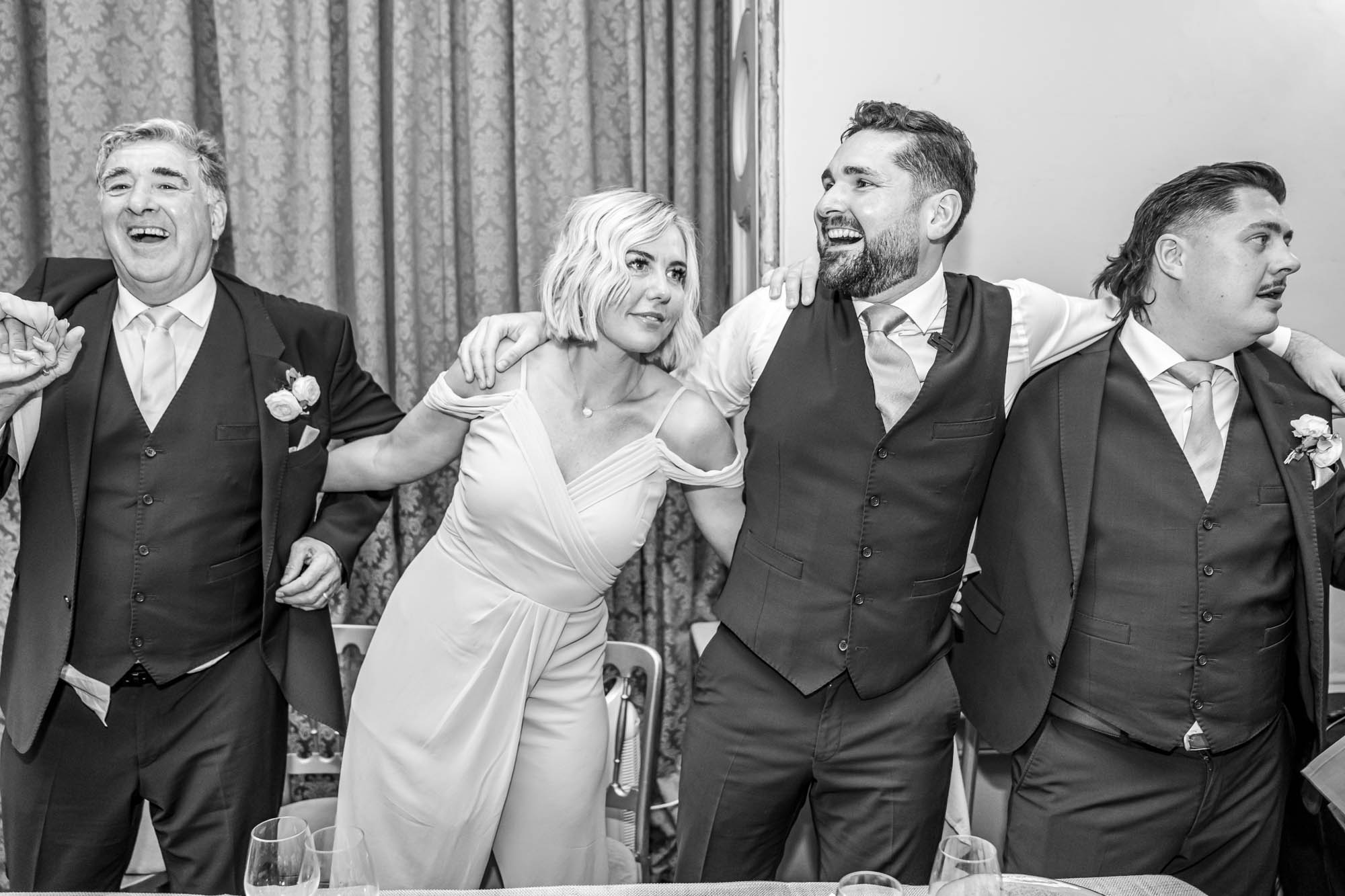 Groom dances at wedding.