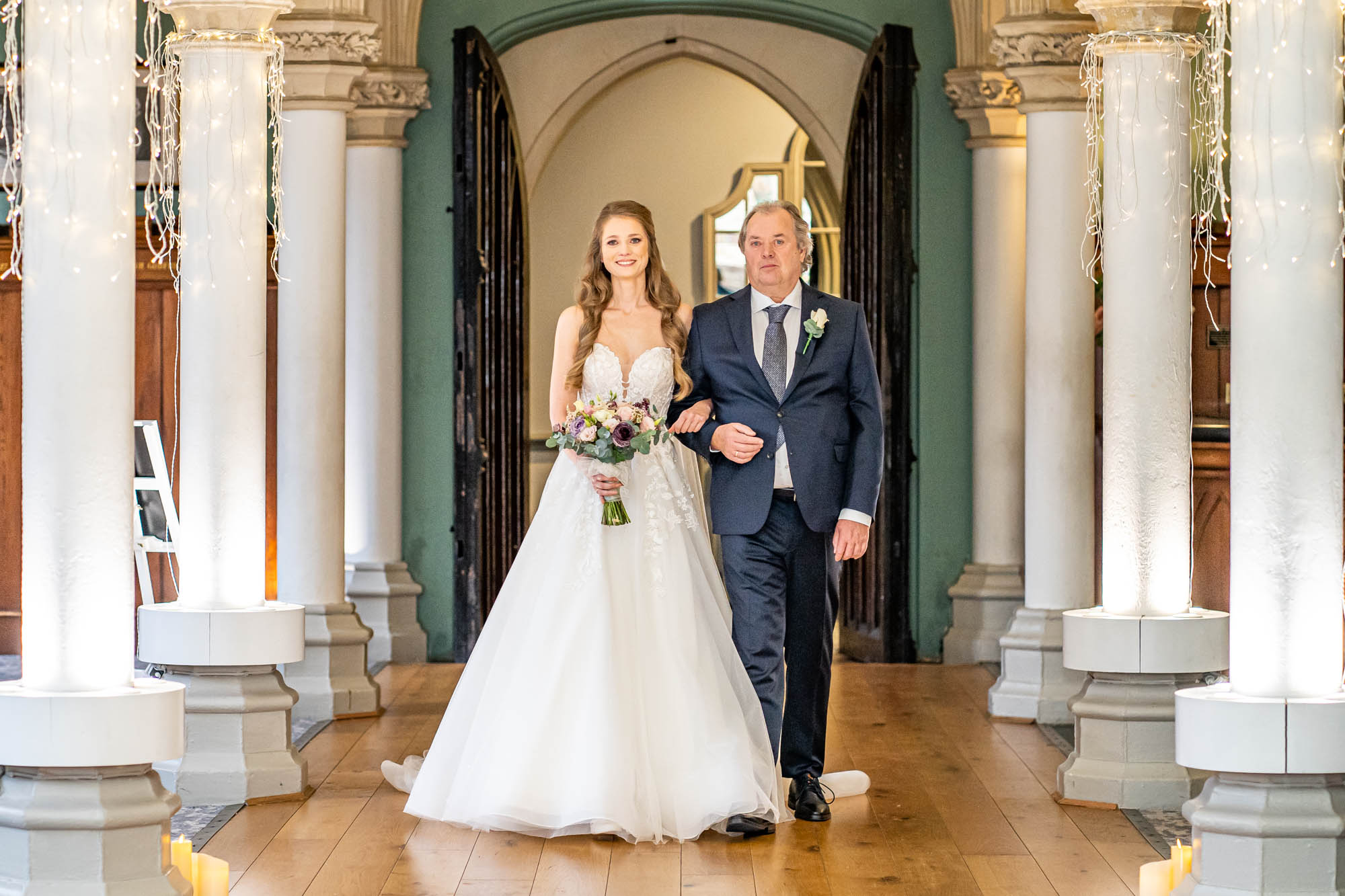 Bride walking down the aisle with her father 