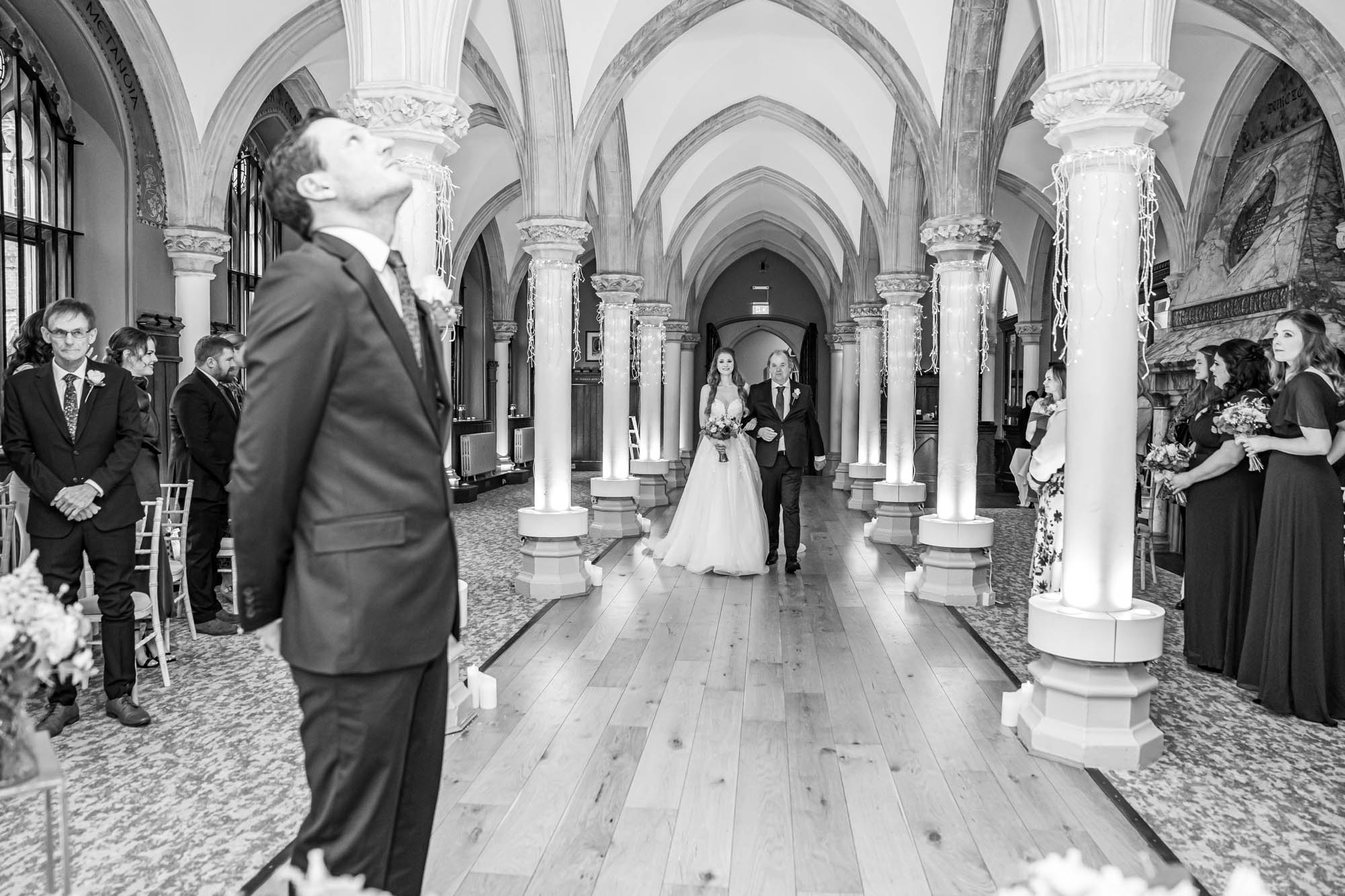 Father of the bride walks his daughter down the aisle.
