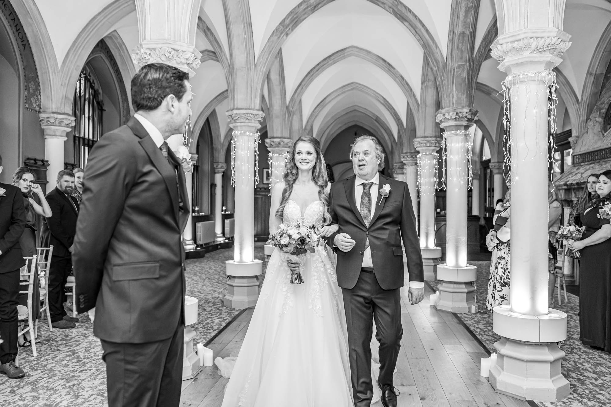 Bride meets groom at aisle.