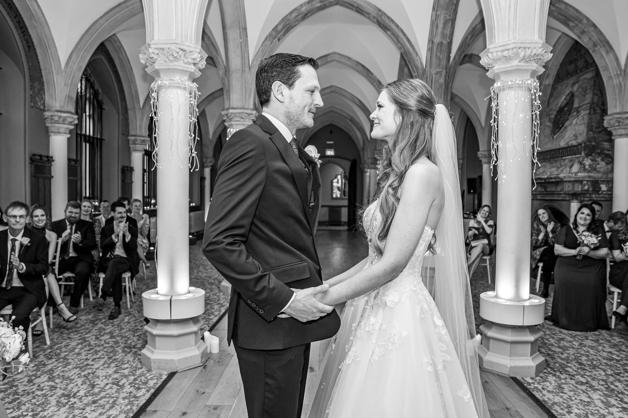 Bride and groom hold each other.