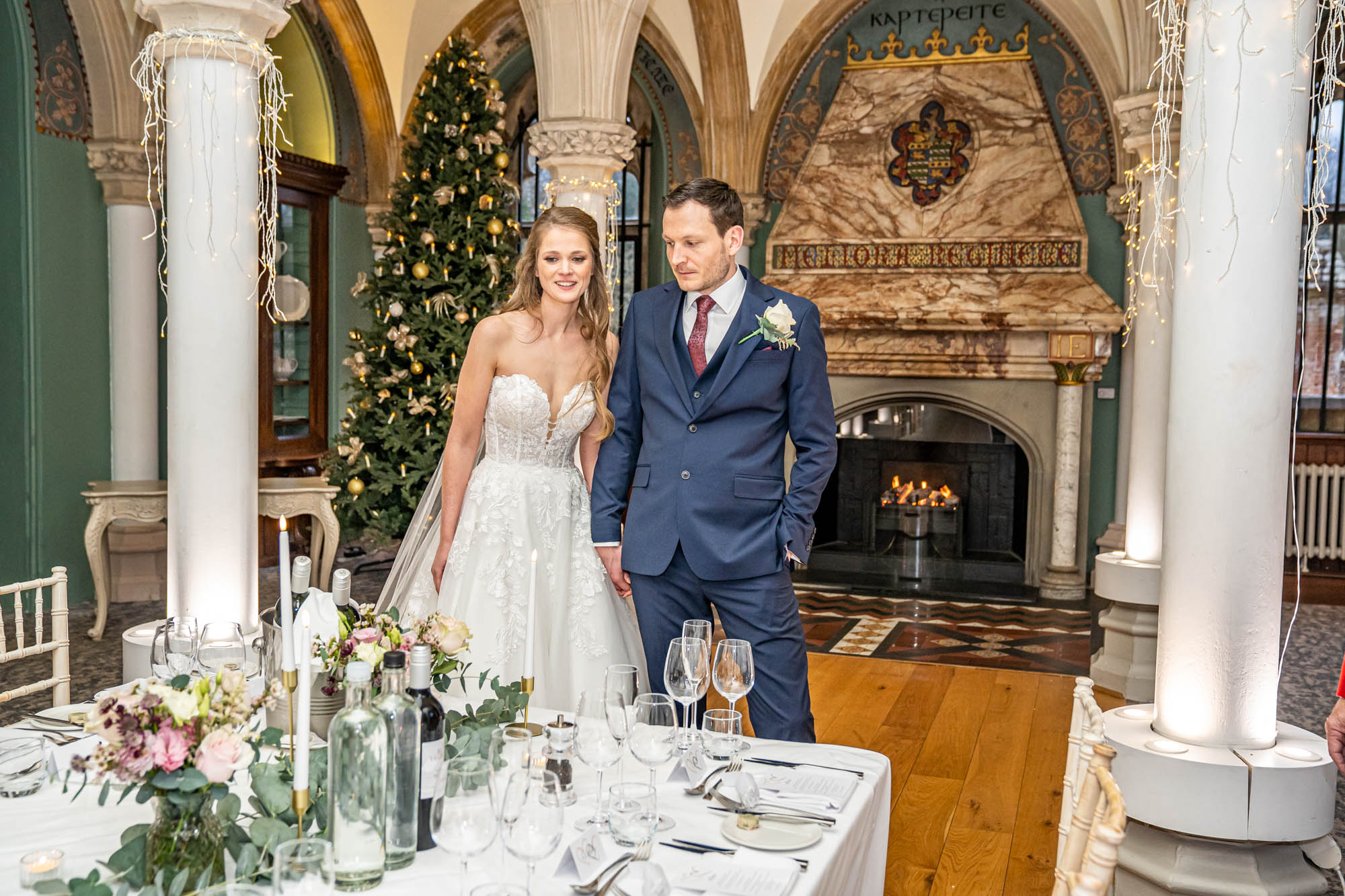Newlyweds viewing their wedding breakfast table.