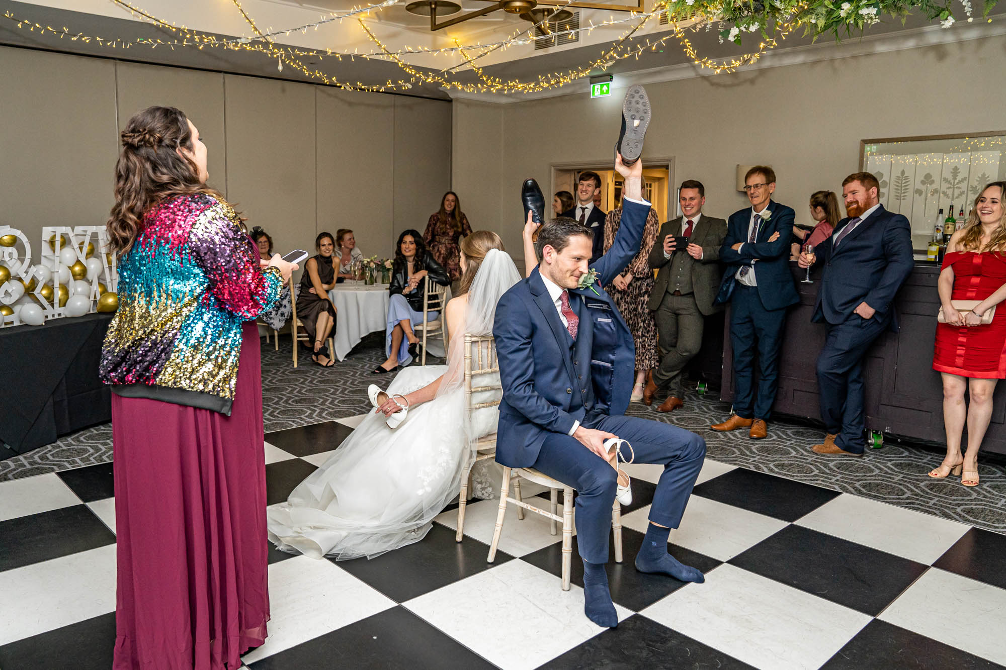 Groom and bride play a wedding game.